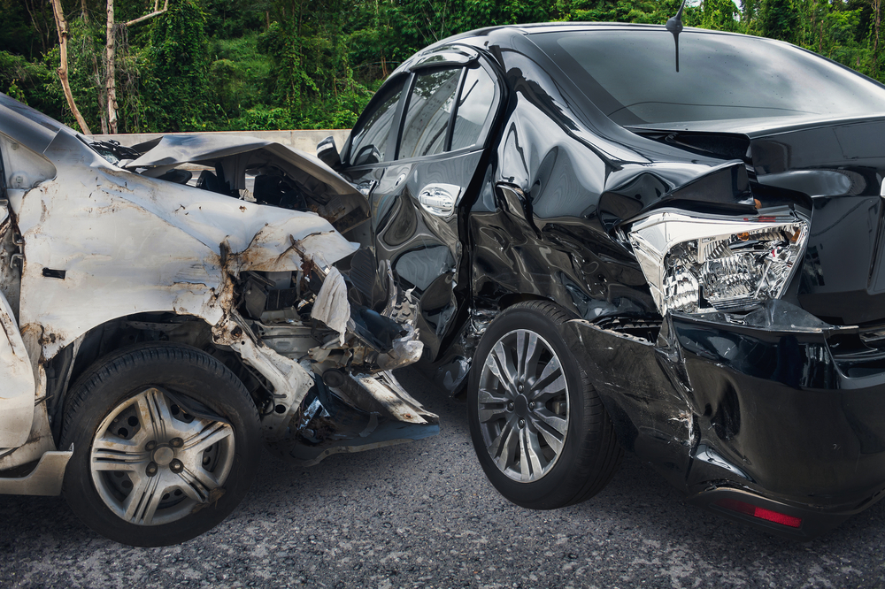 Car accident scene with damaged vehicles and emergency responders